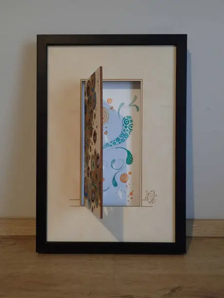 Cadres gravés au laser pour une exposition d'aquarelles
